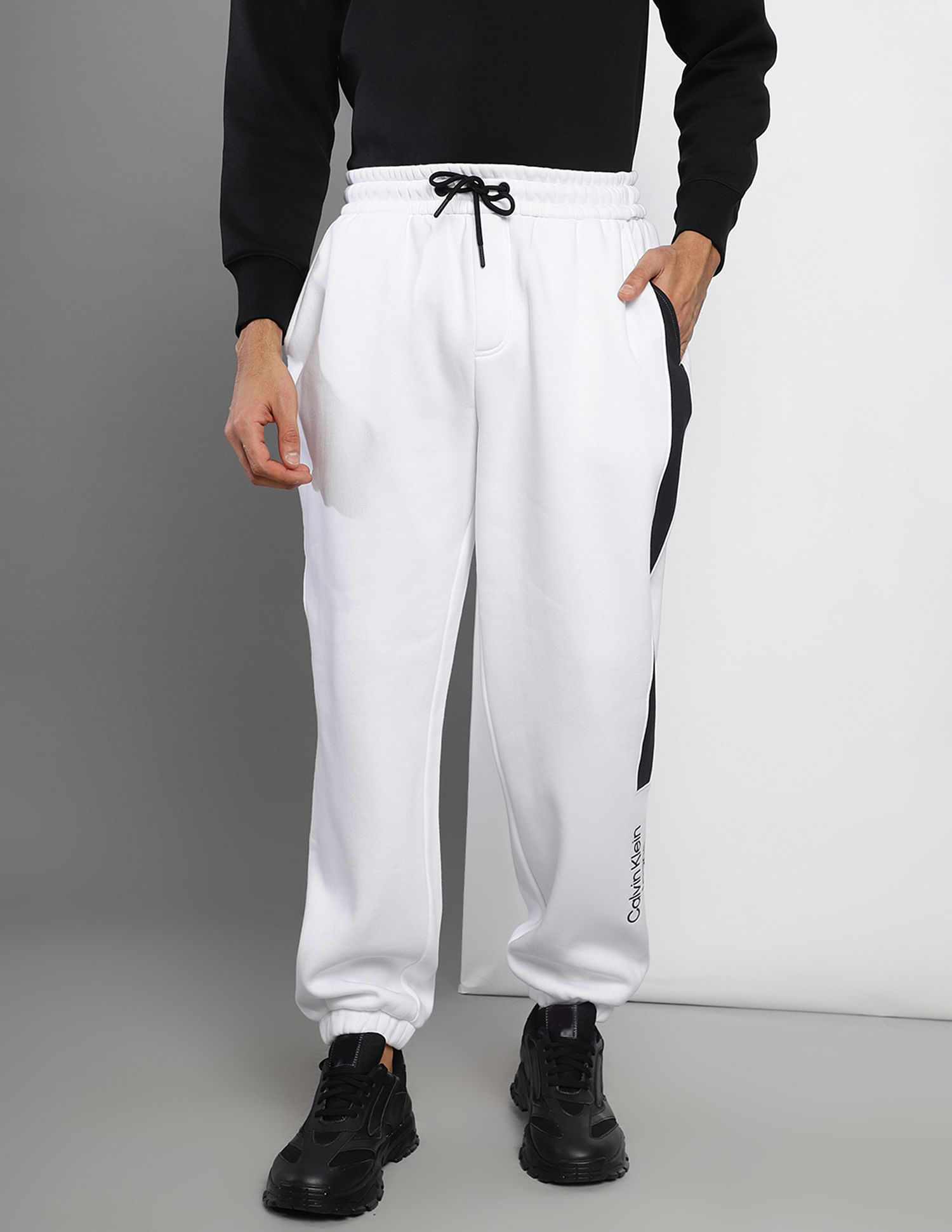 Buy Calvin Klein Men White Brand Print Knit Joggers NNNOW