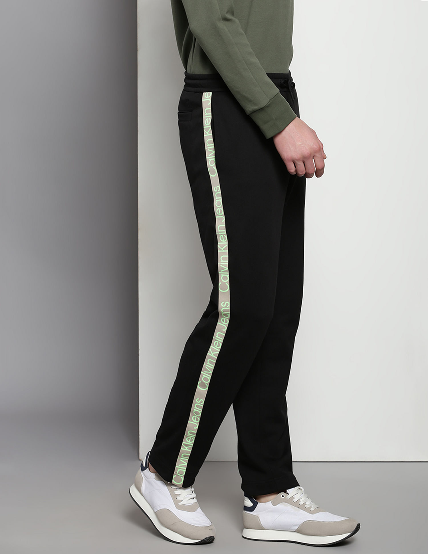 Buy Calvin Klein Mid Rise Brand Tape Track Pants NNNOW