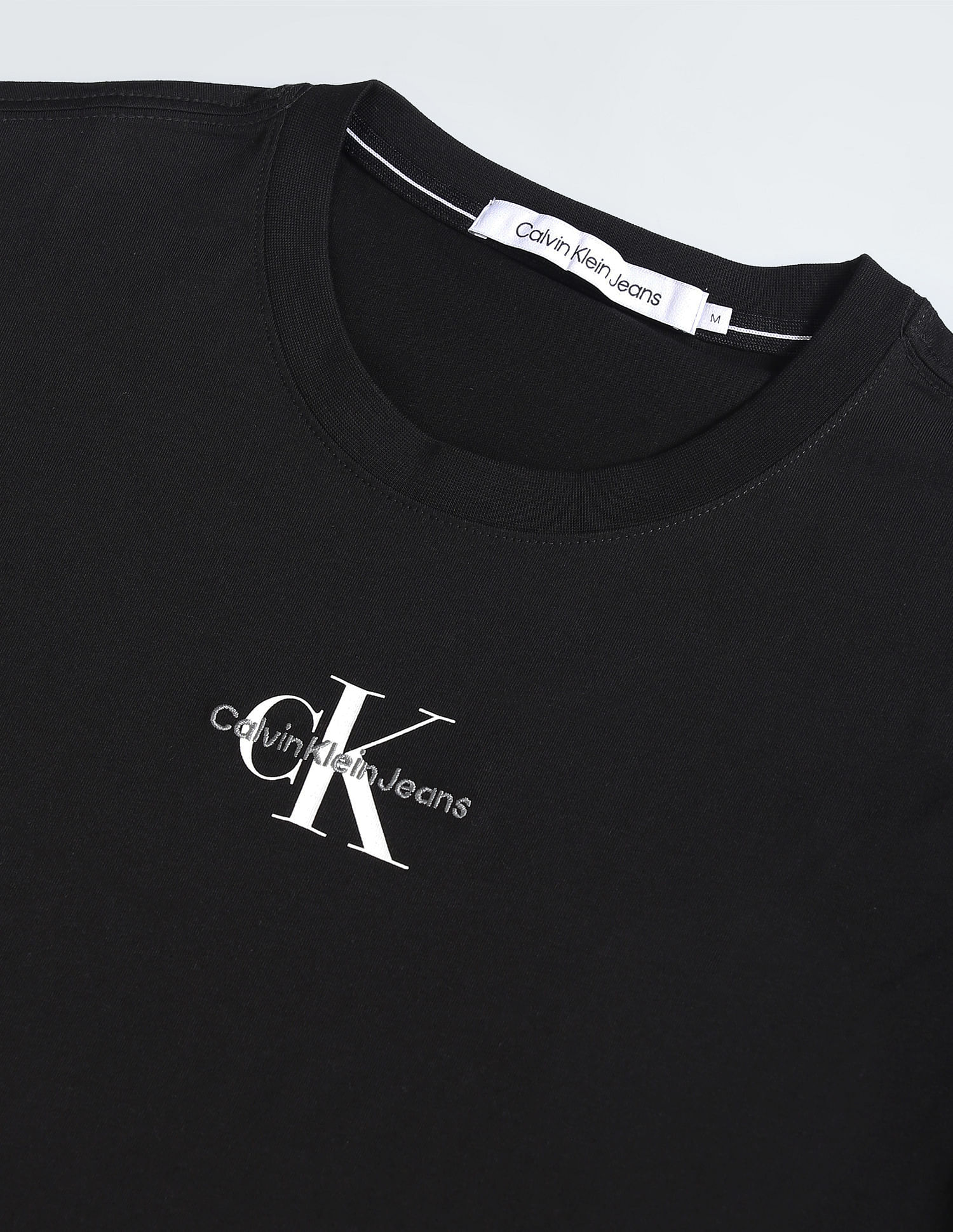 Calvin Klein Jeans logo tape shoulder t-shirt in black, ASOS