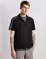 Calvin Klein Jeans Mens Black Solid Polo Shirts